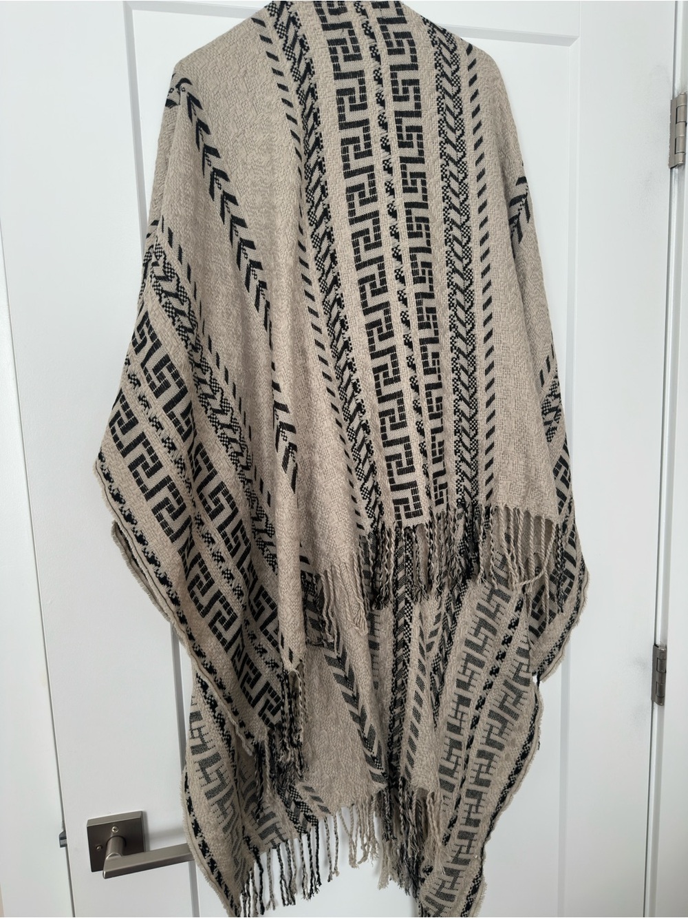Beige and Black Patterned Fringe pullover cape.